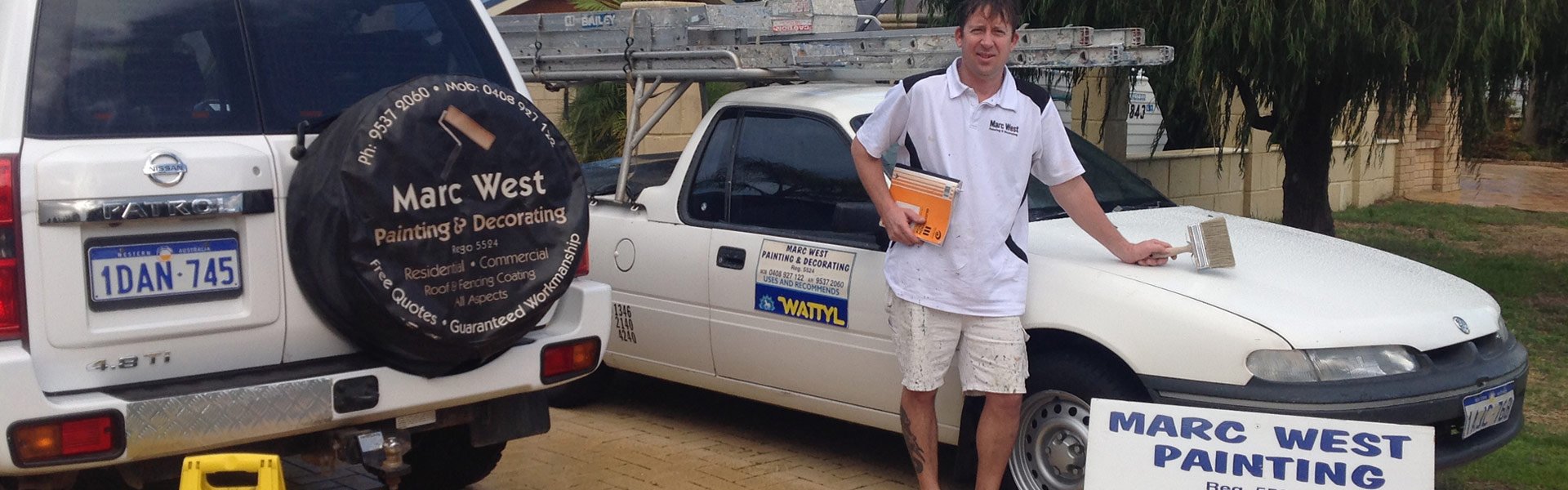 marc west painting and decorating person standing near car